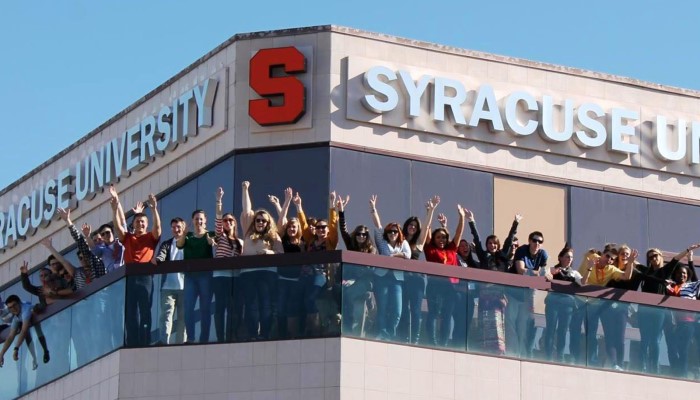 Syracuse in LA building balcony lined with students